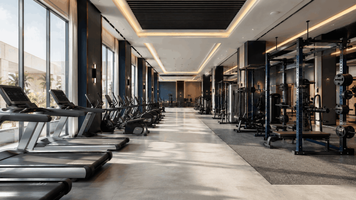 Modern commercial gym equipped by Delta Fitness Authority, showing cardio and strength training machines in a professional fitness facility